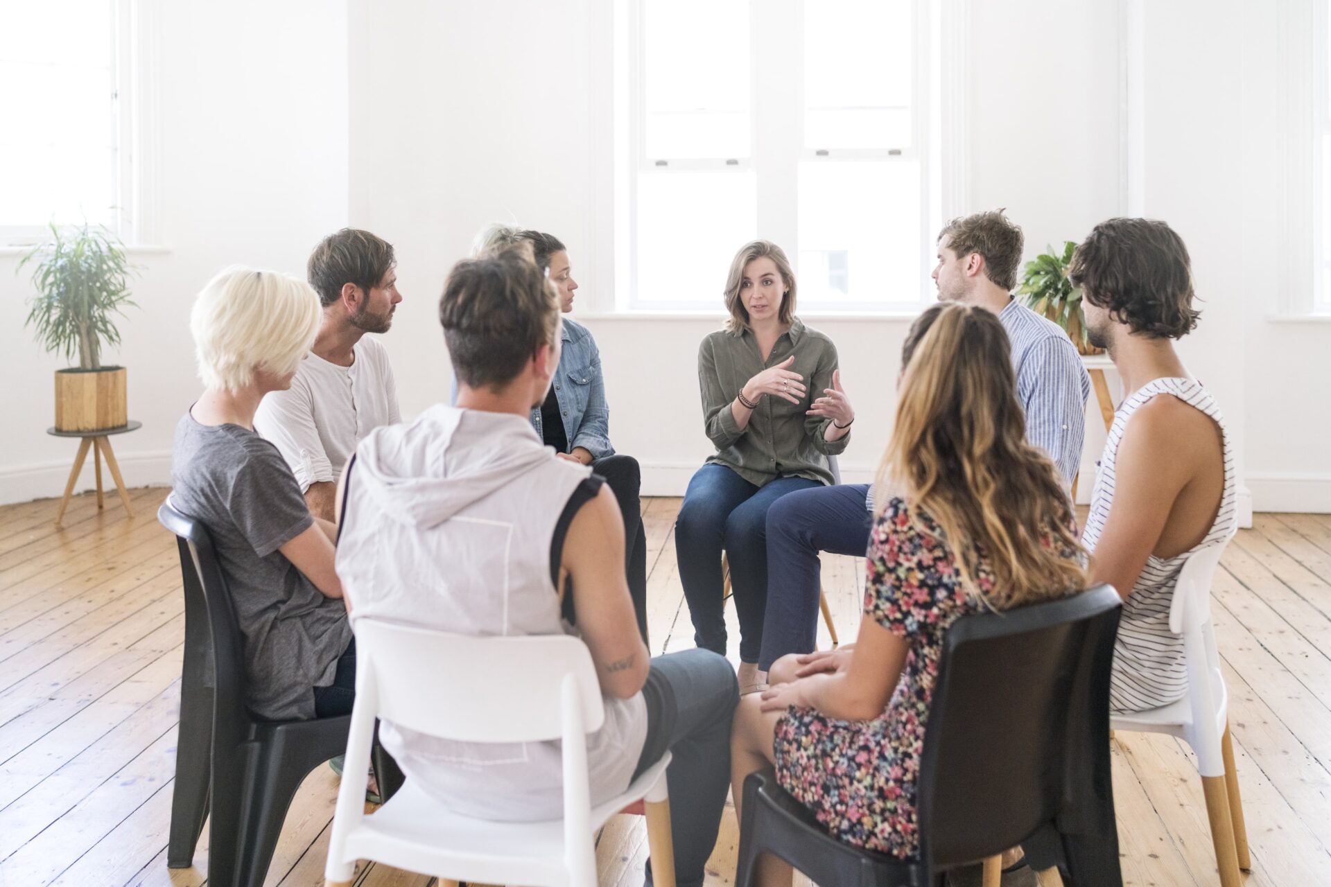 Multiple individuals in a group therapy session.